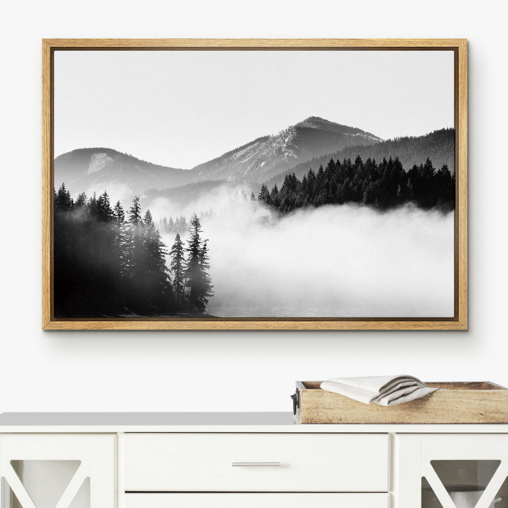 Custom framed canvas with mountain artwork displayed in a pecan floating frame